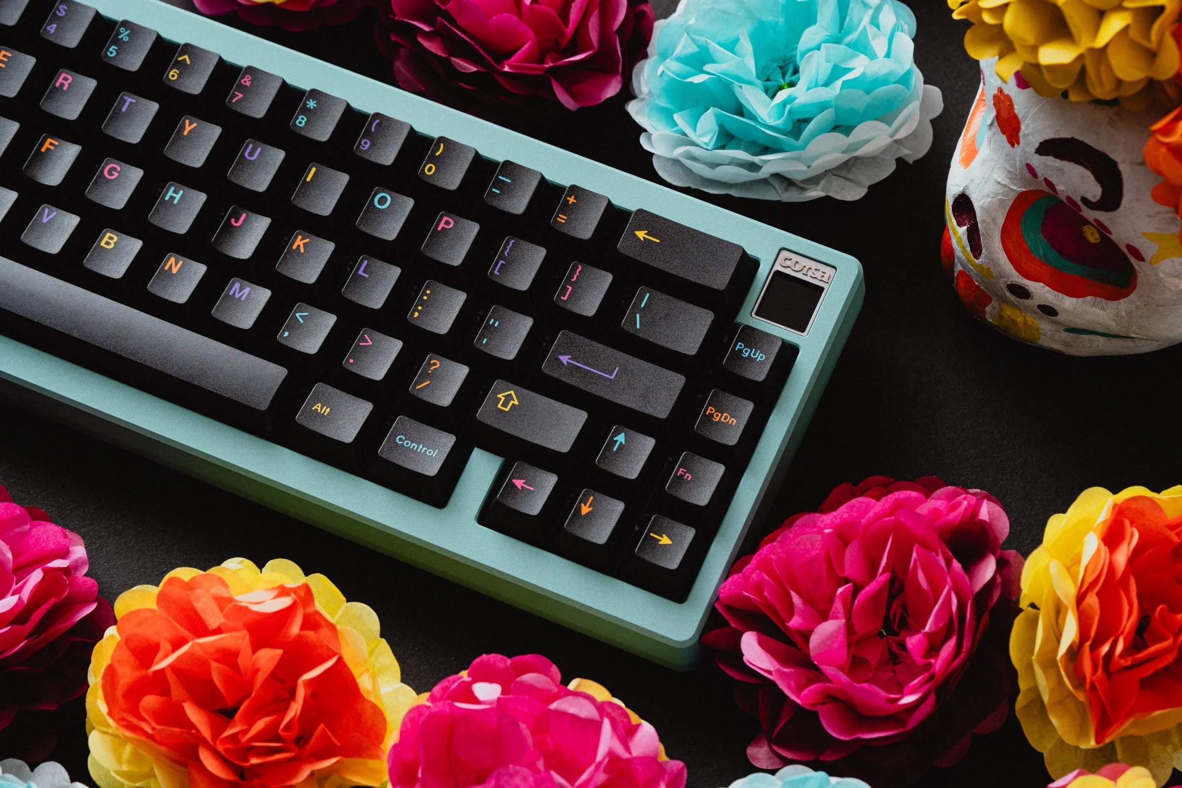 GMK Mictlán keycaps with colorful legends on teal keyboard